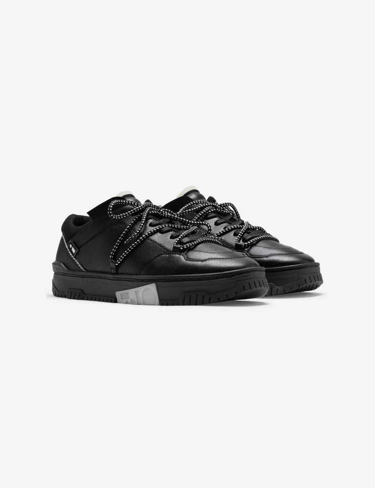 702 triple black low top sneaker