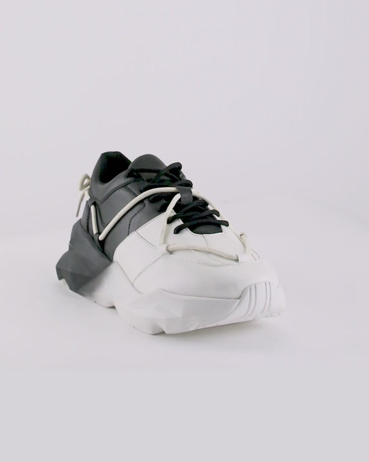 712 black white spray chunky sneaker