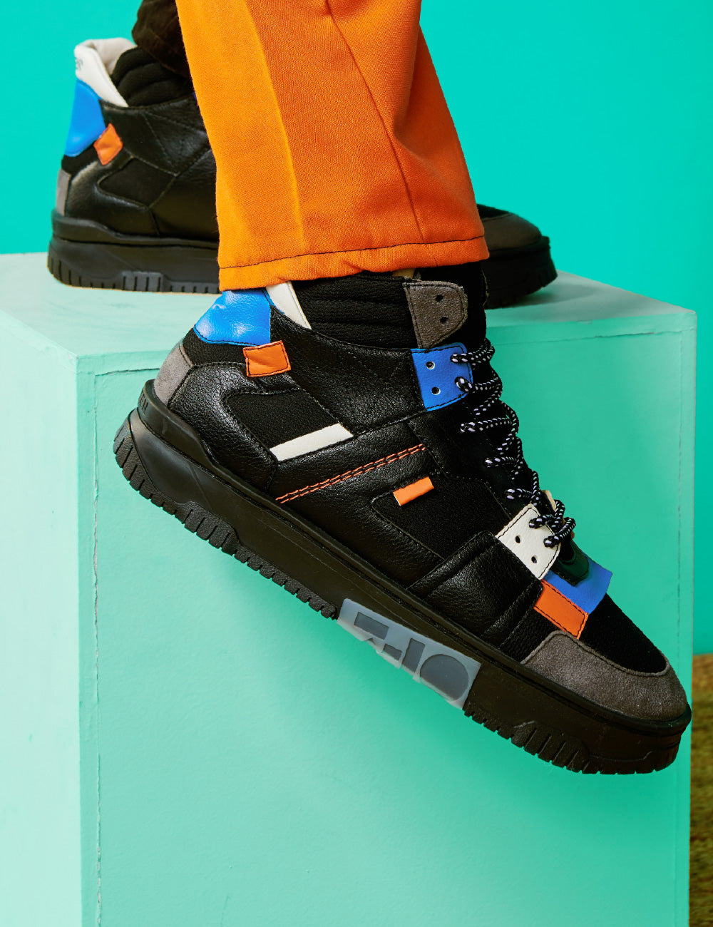 710 black orange blue mid-top sneaker